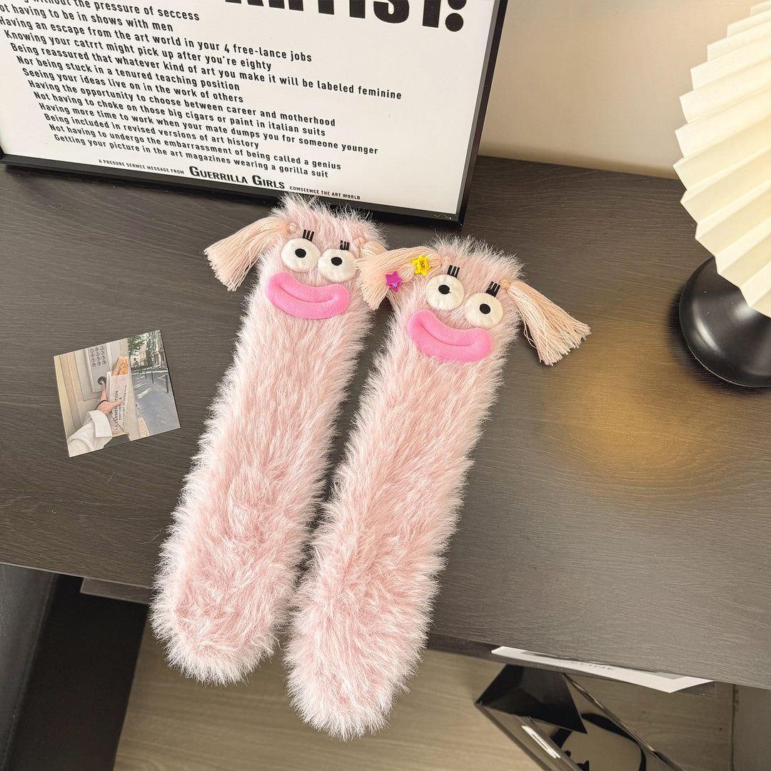 Fluffy socks with googly-eyed monster faces