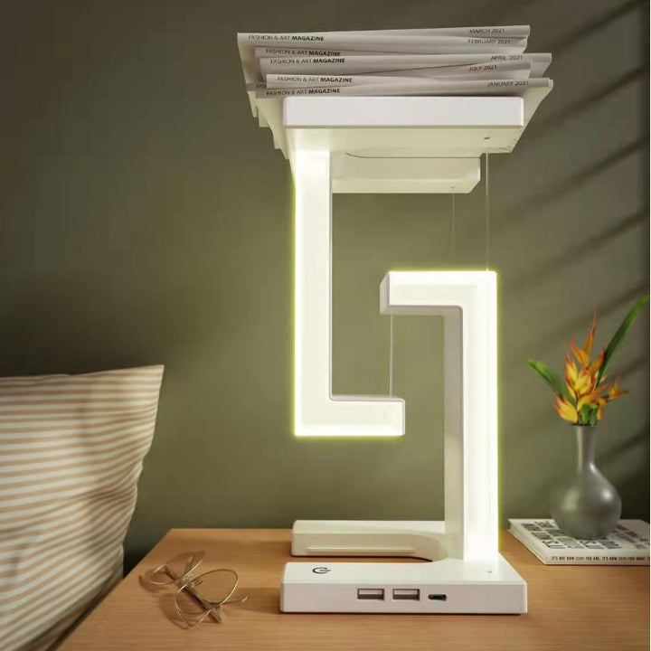 Floating balance lamp with phone on charging base