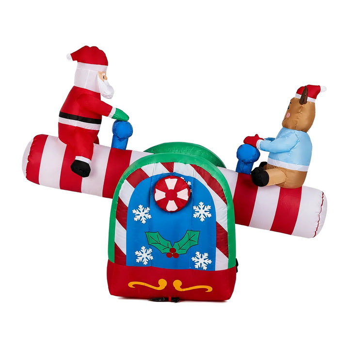Inflatable Santa and reindeer on seesaw