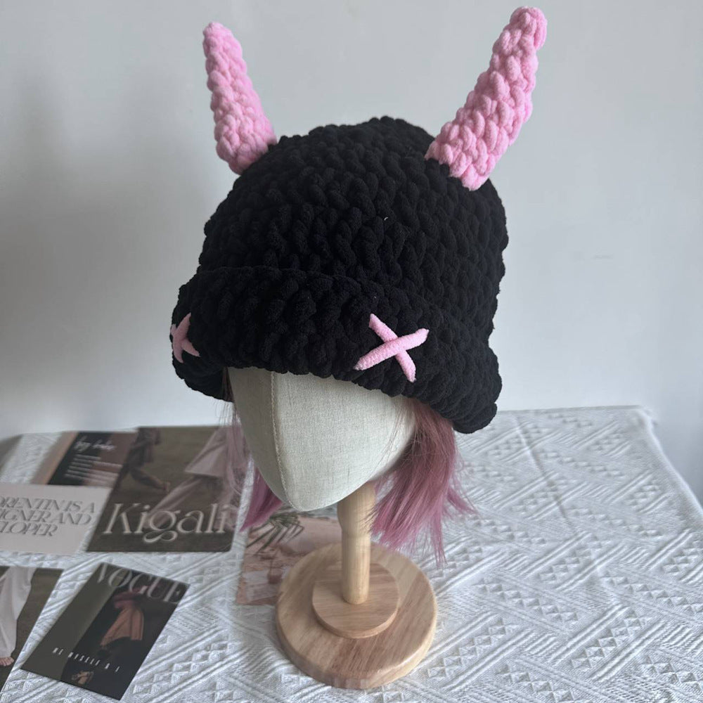 Black crochet bucket hat with pink horns