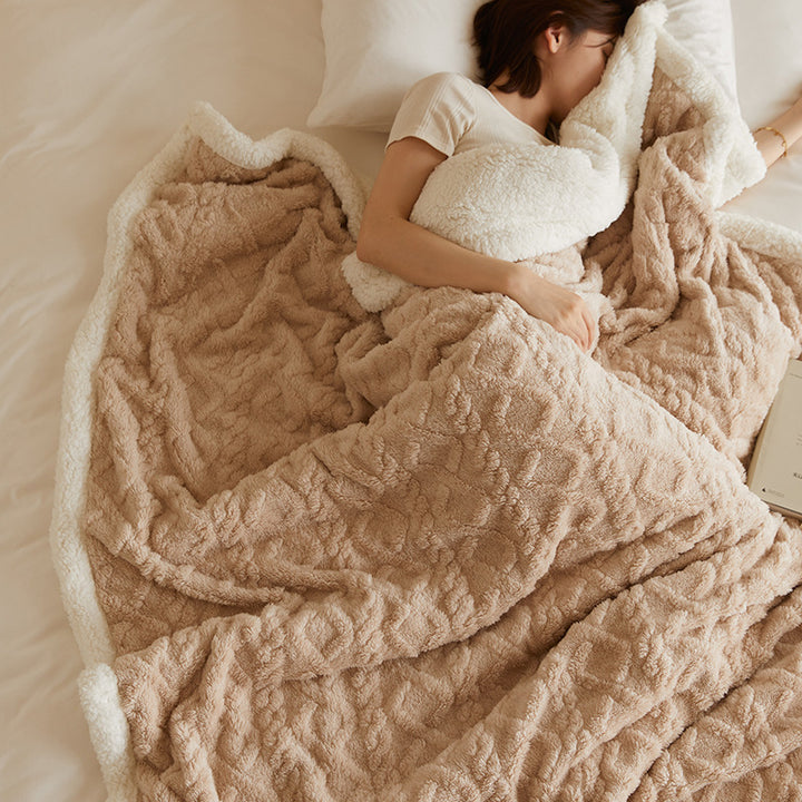 Tufted fleece throw draped over sofa