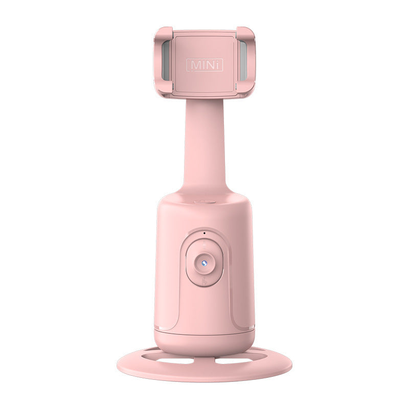 Face-tracking phone holder rotating with phone