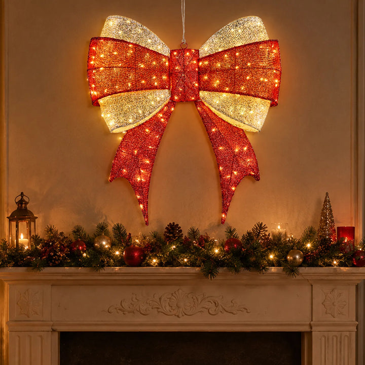 Large lit red and gold Christmas bow