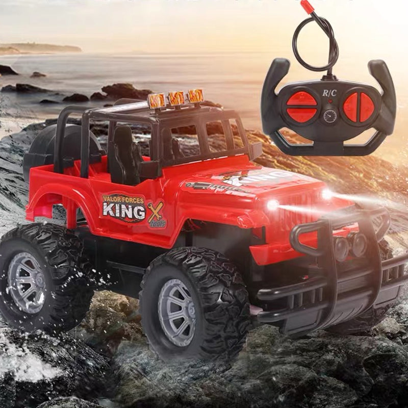 Red remote control jeep on grass
