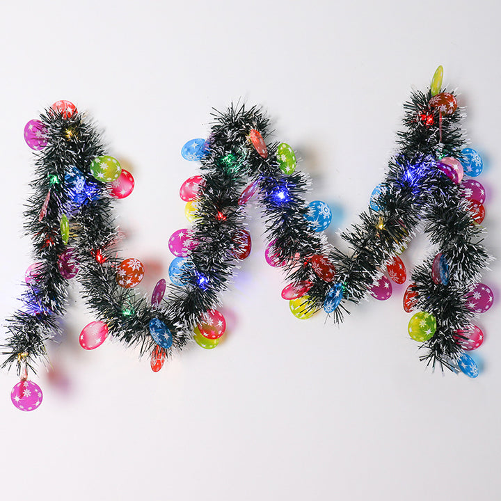 Tinsel Christmas garland with lights and Santas