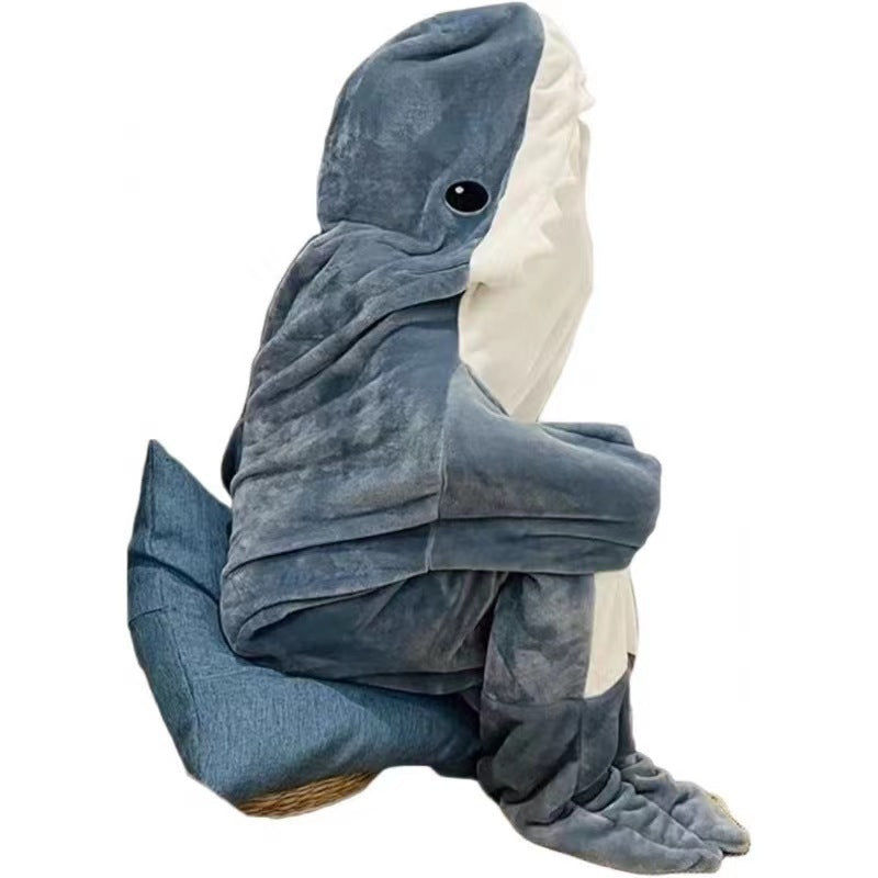 Person wearing grey shark hooded blanket