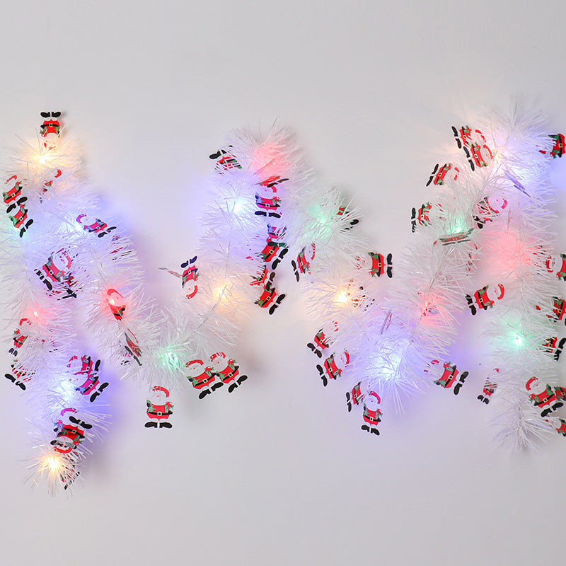Tinsel Christmas garland with lights and Santas